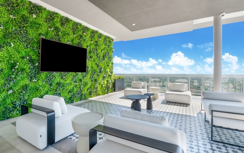 Rooftop sky deck featuring TV and comfortable lounge furniture