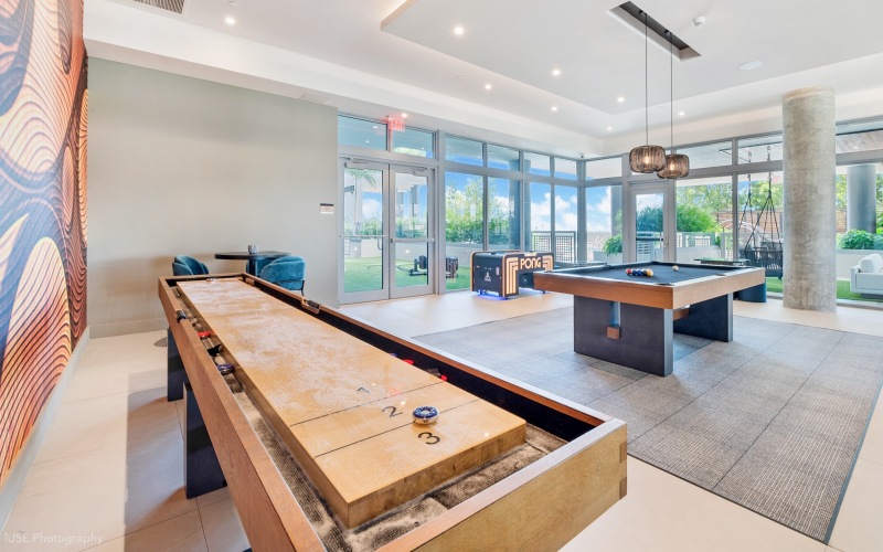 Modern resident lounge with pool table and seating area